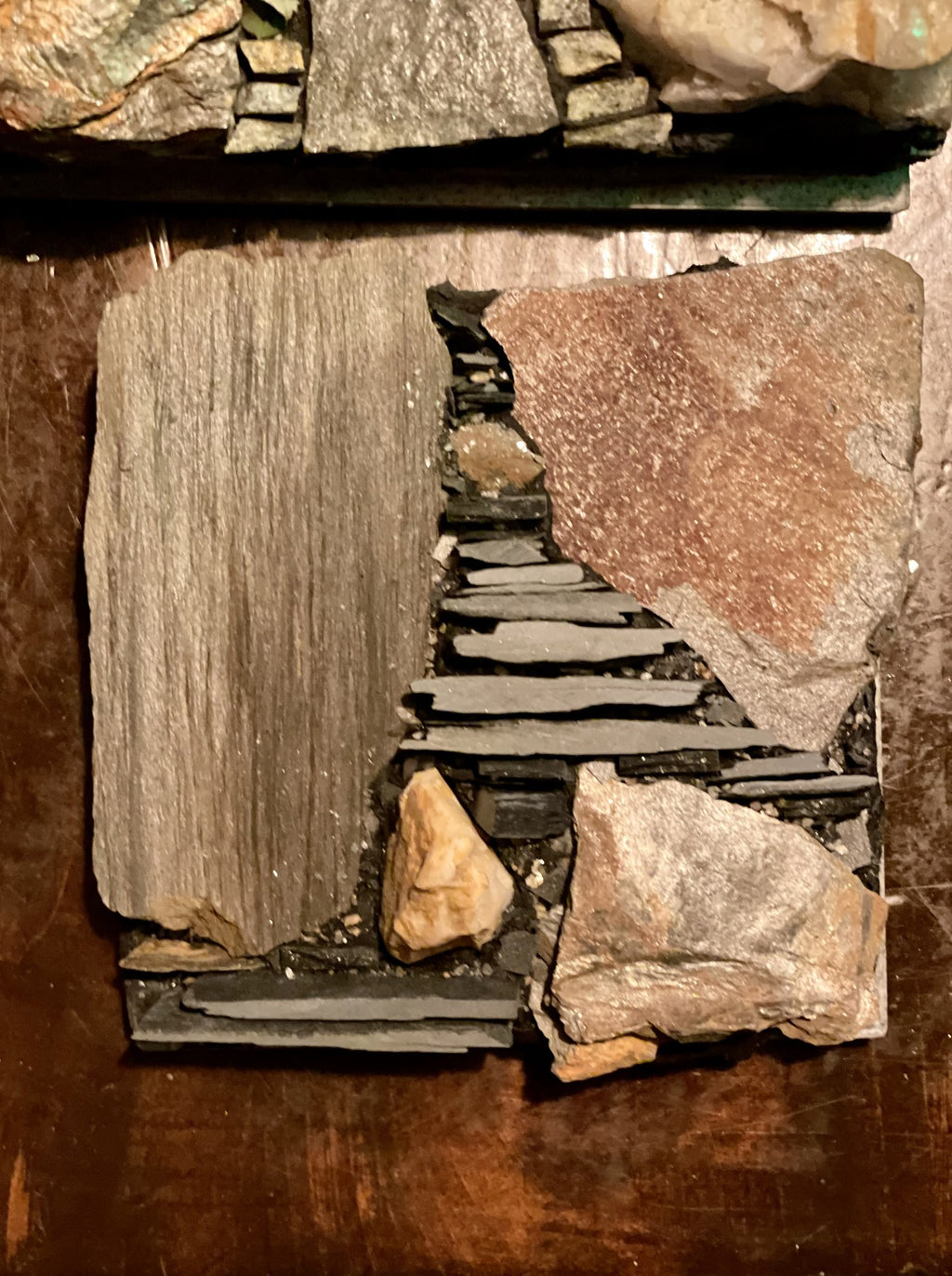 Finished slate mosaic panel with wood-grain slate and stacked hand-split slate rods