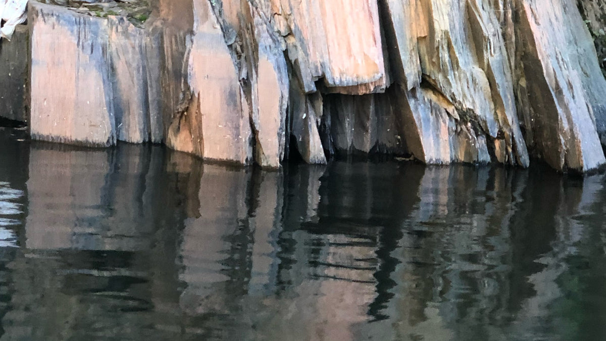 Quarry slate rock face, waterline centered