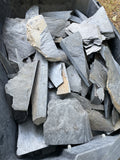 Wheelbarrow heaped with hand-gathered Maryland scrap slate