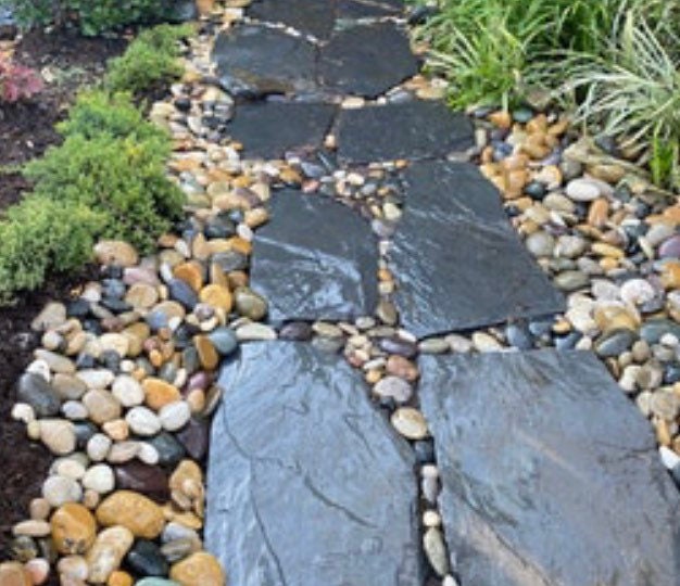 Ten Natural Slate stepping stones as a path. 
